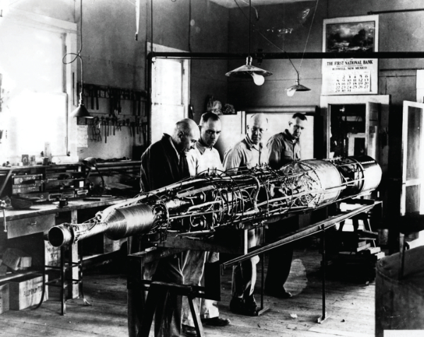 Dr. Robert H. Goddard works with his team at his lab in Roswell. 