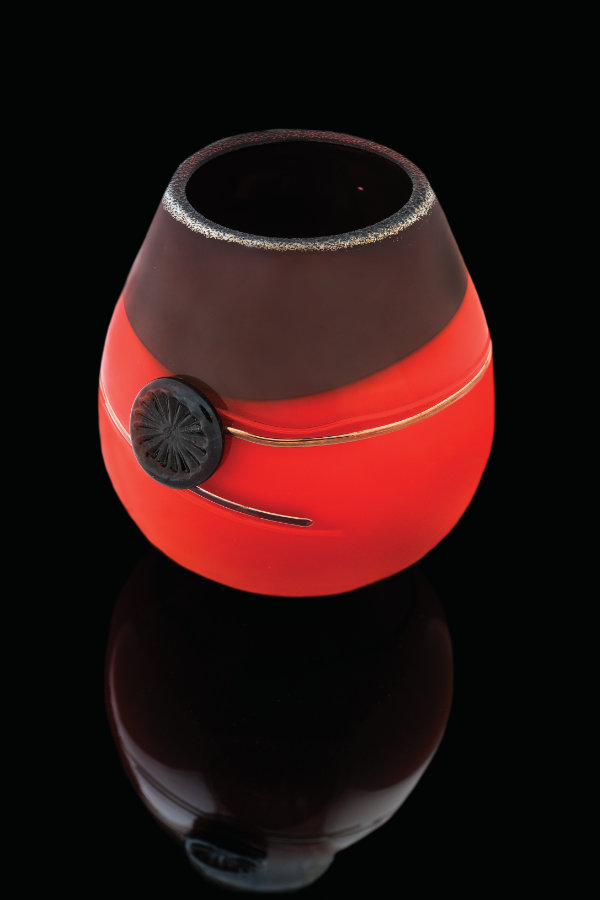 Tony Jojola (Isleta Pueblo), untitled, 2014. Blown glass with silver stamps. 8 1/10 × 74/5 in. MIAC Collection: 59229. Photograph by Kitty Leaken. Courtesy the Museum of Indian Arts and Culture.