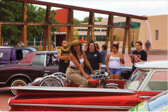 Locals celebrate Qué Chola, a 2019 exhibition at the Art Museum, in high lowrider style. Photograph by Addison Doty.