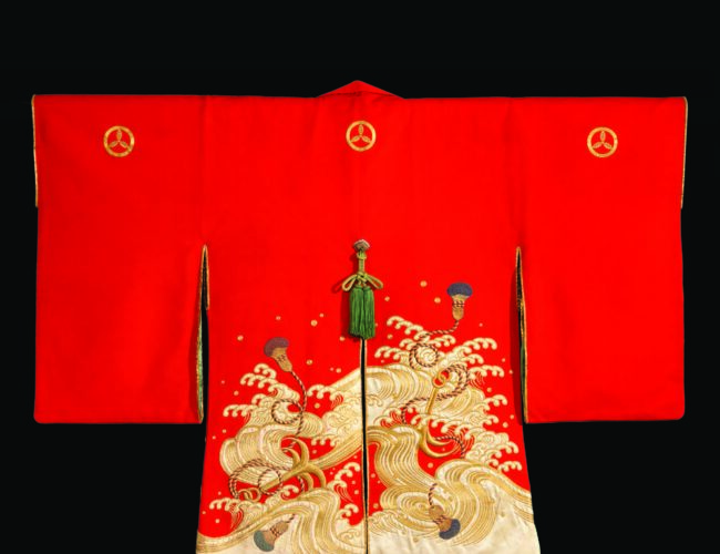 Firefighter’s ceremonial coat (kajibanten), Japan, eighteenth– nineteenth century, Edo period. This cochineal-dyed cape was likely only used for ceremonial purposes. A sturdier coat, often made of leather, would be worn during firefighting. Wood with gold- and silk-thread embroidery and appliqué, 38 × 48 in. John C. Weber Collection. Photograph by John Bigelow Taylor.