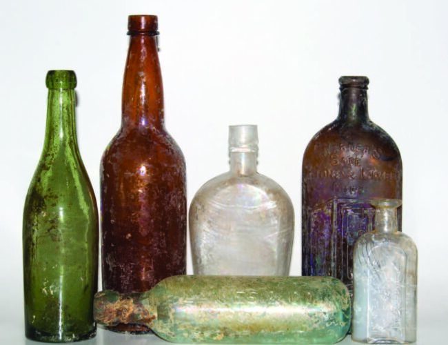 Medicine and alcohol bottles from excavations at the site of the Fort Marcy Military Reservation. Photograph by Gloria Lovato.