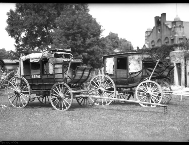 Two Barlow, Sanderson stagecoaches presented to the Historical Society of New Mexico by Mrs. Arthur (Frankie) Seligman, Palace of the Governors courtyard, Santa Fe, New Mexico, 1935. Palace of the Governors Photo Archives (NMHM/DCA), Neg. No. 011942.