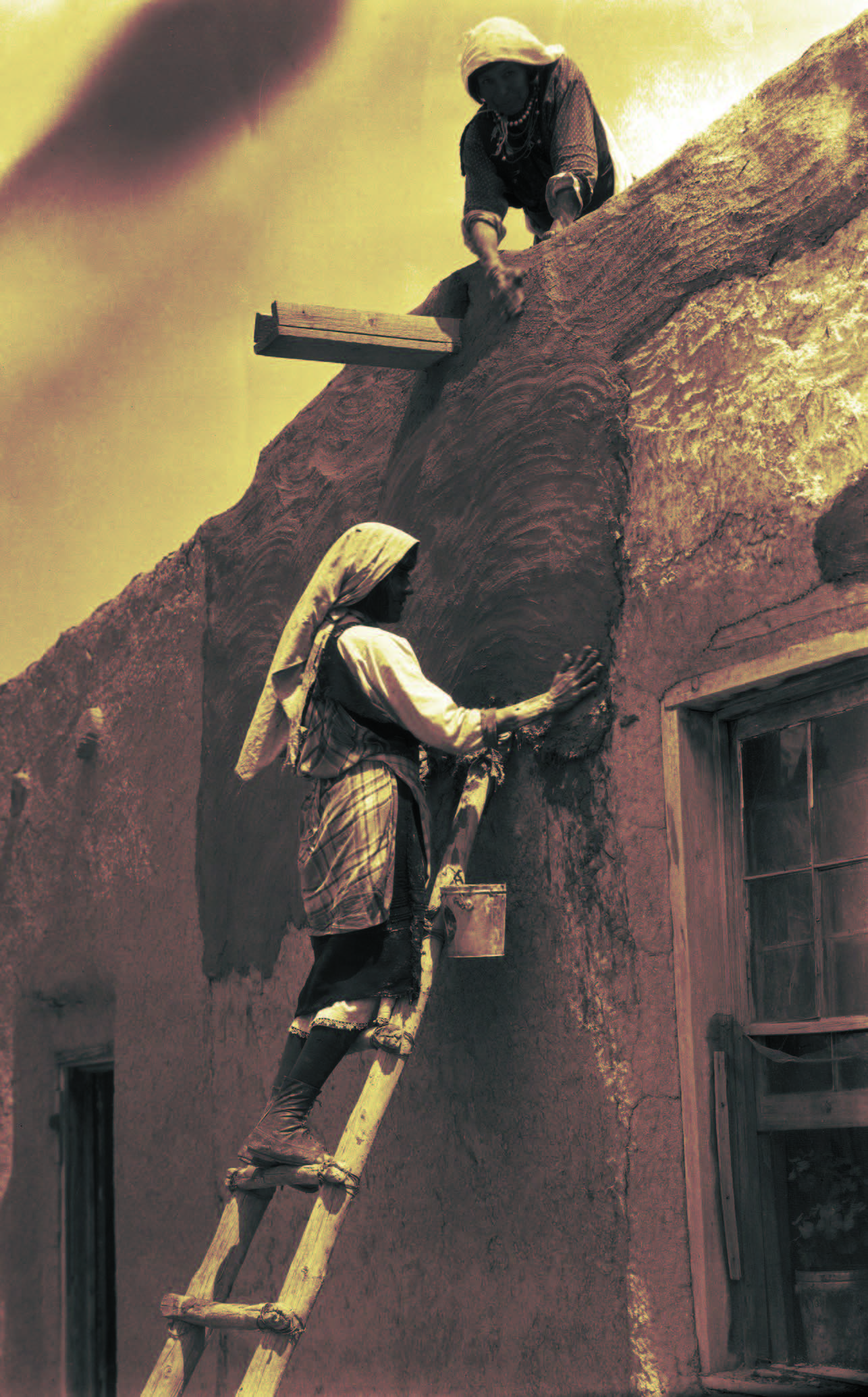 Women replastering a house in Paguate Village at Laguna Pueblo in New Mexico, 1925, by Edward S. Curtis. Palace of the Governors Photo Archives (NMHM/DCA), Neg. No. 031961.