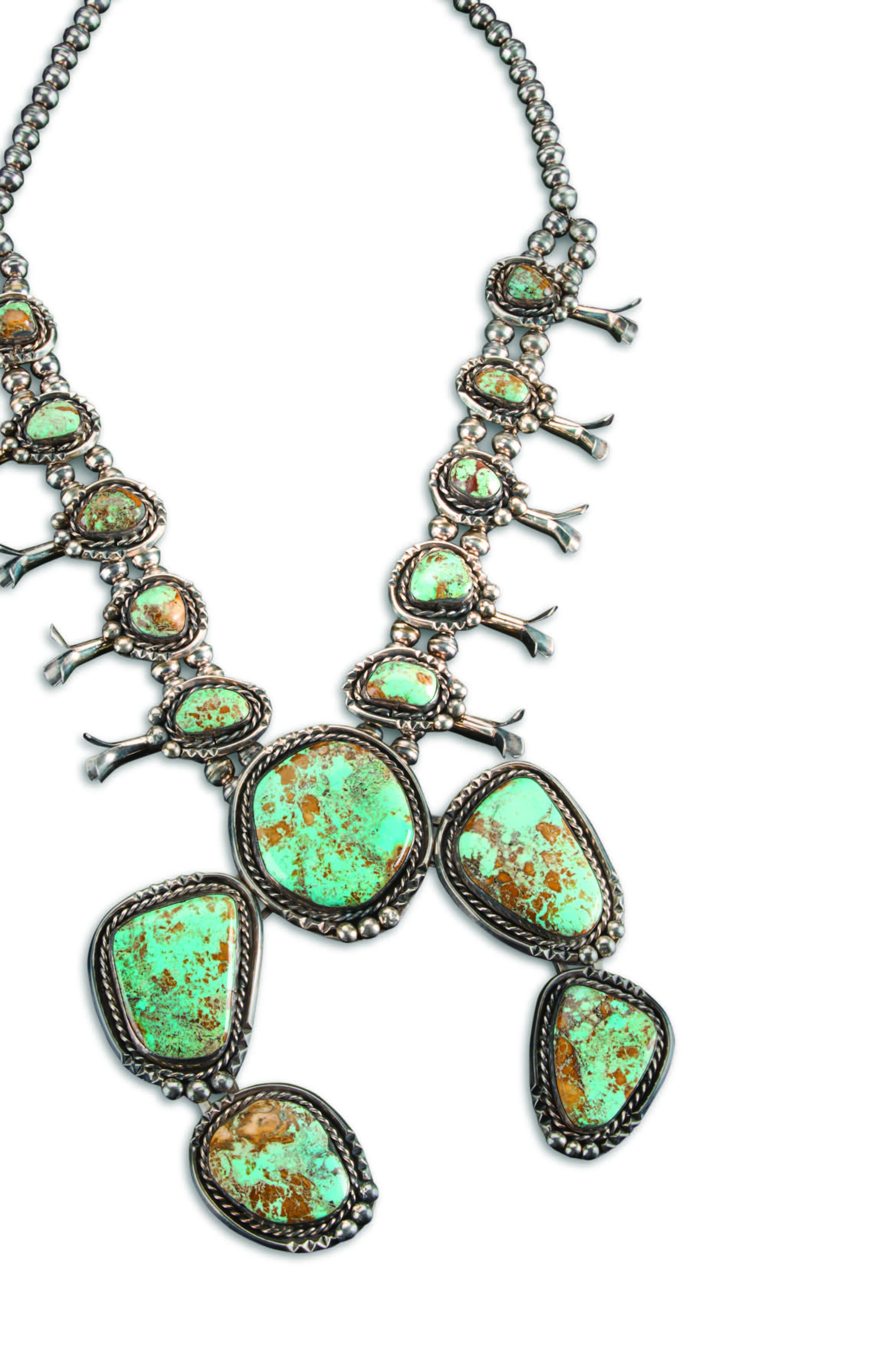 Squash-blossom necklace, ca. 1970s. Navajo. Silver, Royston turquoise. Museum of Indian Arts and Culture, DCA 56966/12, gift of Marie and Harry J. Barker