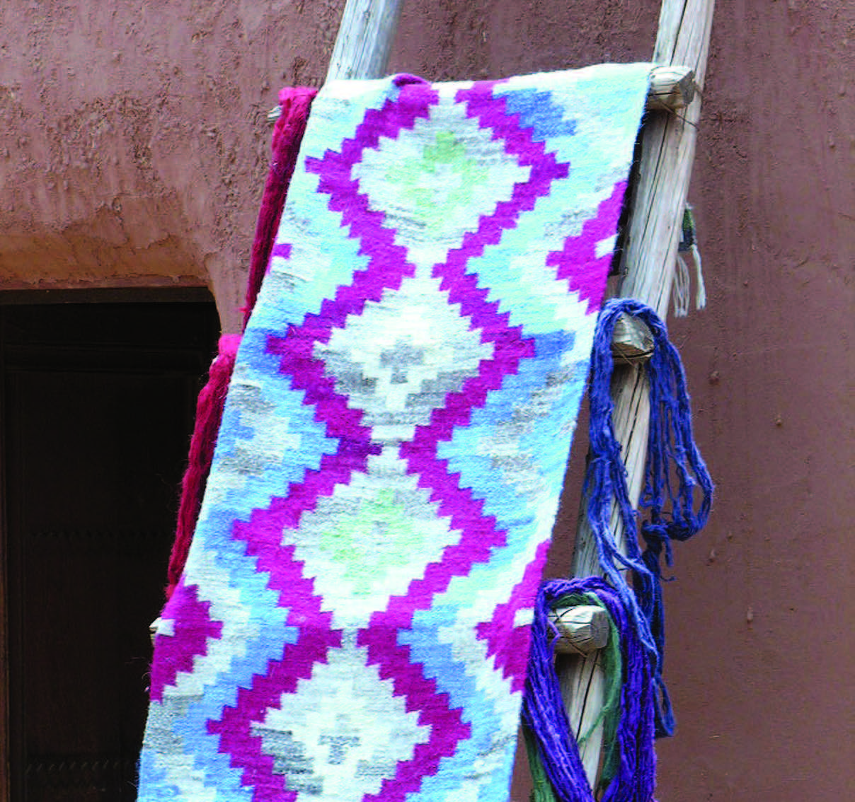This summer, weavers at Las Golondrinas experiment with purple — a color not commonly found in Rio Grande textiles. Photograph courtesy of El Rancho de las Golondrinas.
