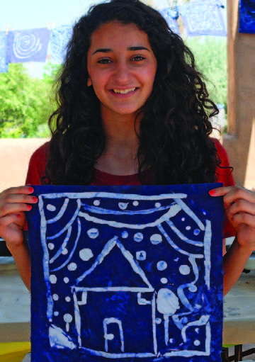 Israeli, Palestinian, and New Mexican workshop participants with their indigo batik quilt blocks: Duaa