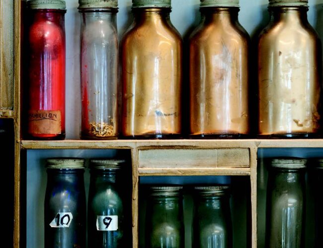 Some of Baumann’s colorful pigments, neatly stored in pharmaceutical bottles. All objects Collection of the Press at the Palace of the Governors, New Mexico History Museum. Photographs by Blair Clark.