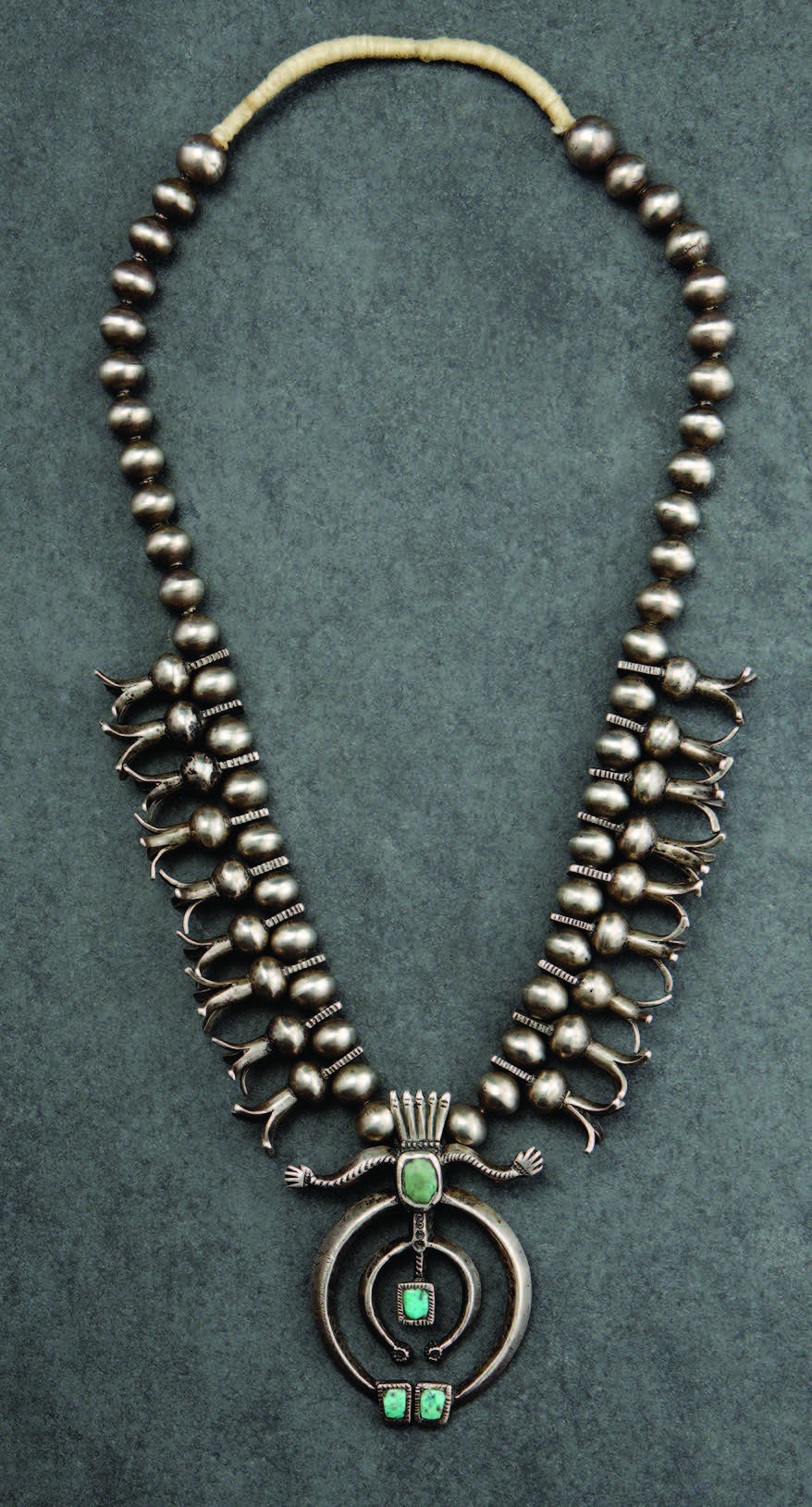 Squash-blossom necklace by Slender Maker of Silver (Navajo), ca. 1885. Silver, turquoise.