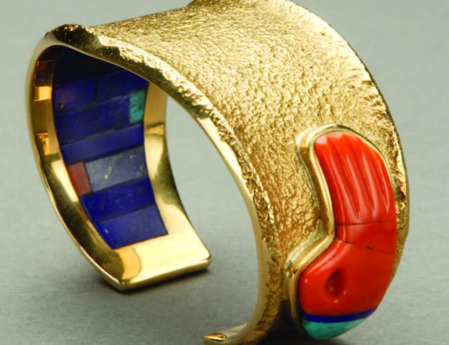 Carl Lewis Druckman Collection; museum purchase. Bracelet with badger paw by Charles Loloma (Hopi), ca. 1985. Gold, coral, turquoise, lapis lazuli.
