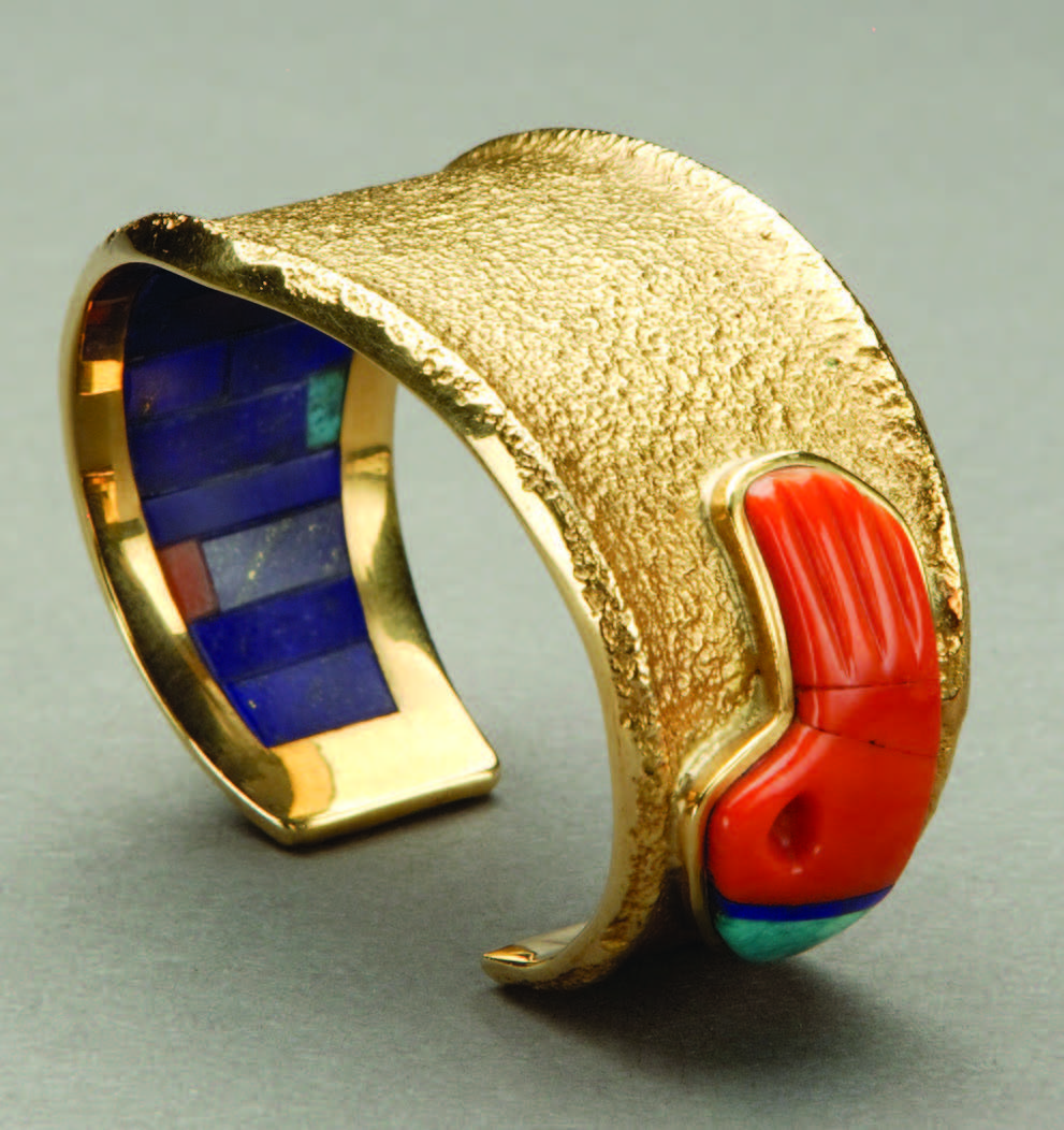 Carl Lewis Druckman Collection; museum purchase. Bracelet with badger paw by Charles Loloma (Hopi), ca. 1985. Gold, coral, turquoise, lapis lazuli.