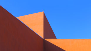 The stepped roofline of the Roy E. Disney Center for the Performing Arts cuts a dramatic impression into the Albuquerque sky. Photograph by Addison Doty.