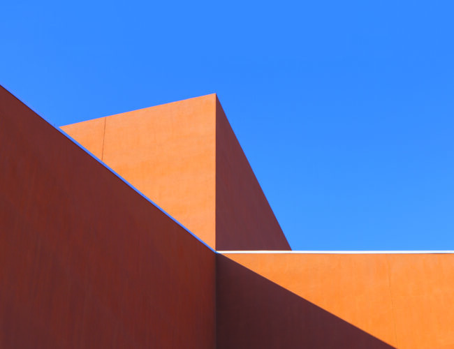 The stepped roofline of the Roy E. Disney Center for the Performing Arts cuts a dramatic impression into the Albuquerque sky. Photograph by Addison Doty.