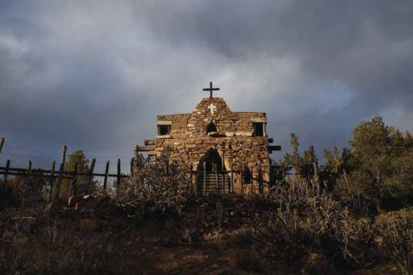 Known as La Capilla de San Ysidro Labrador, this small family chapel was built in 1928 by Lorenzo López, who used rocks gathered from his property and mud from the nearby acequia to construct the walls. Photograph by Simone Frances, 2020.