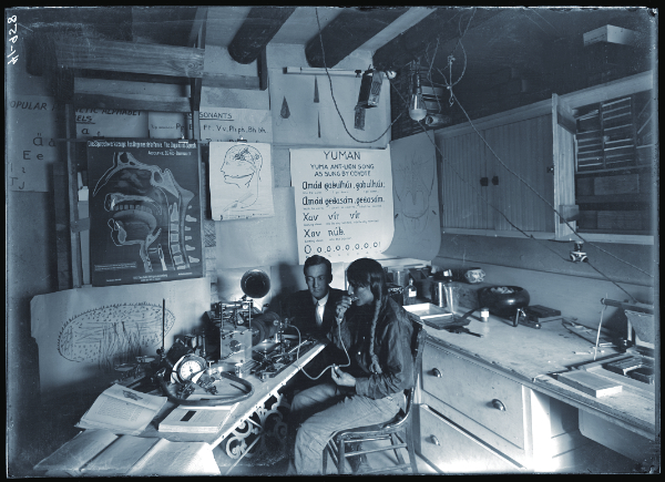 J. P. Harrington and Tewa man (perhaps Julian Martinez?) recording speech in the Language Room in the Palace of the Governors, Santa Fe, New Mexico, ca. 1909-1910. Courtesy the Palace of the Governors Photo Archives (NMHM/DCA), neg. no. 088417.