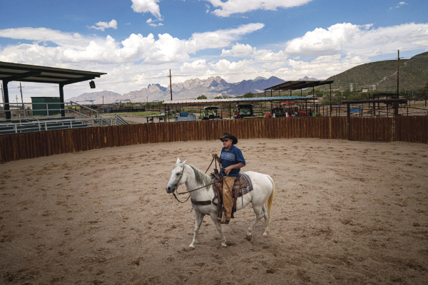 Greg Ball rides his quarter horse Rachel in the museum’s ring.