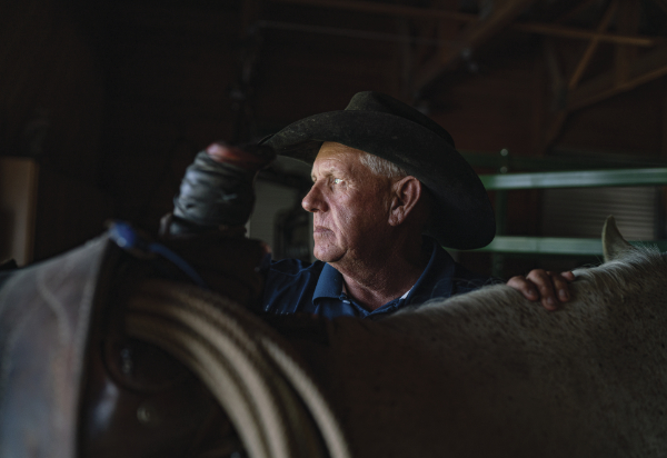 Greg Ball stands next to his quarter horse Rachel after a long day attending to the many animals at the Museum. Ball, who began working at the New Mexico Farm & Ranch Heritage Museum in 1998, is continuing the tradition of ranching and farming that his grandparents instilled in him.