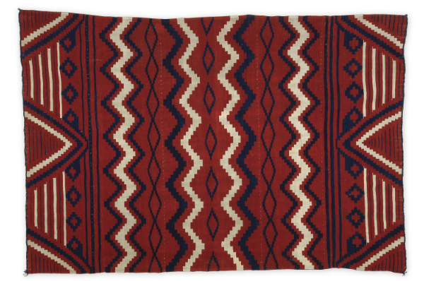 Artist once known (Diné), shoulder blanket,
1850–1860. Handspun wool, cochineal dye, indigo dye, bayeta, lac dye.
80 × 55 inches. Museum purchase. MIAC Collection: 9091/12.