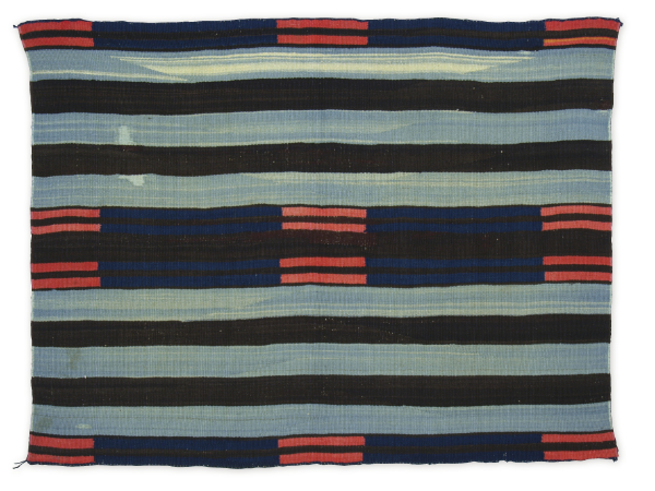 Artist once known (Diné), chief blanket II, ca. 1850–1865. Handspun wool, indigo dye, bayeta, commercial wool yarn. 38 × 50 inches. Gift of Mrs. Philip B. Stewart. MIAC Collection: 9129/12.