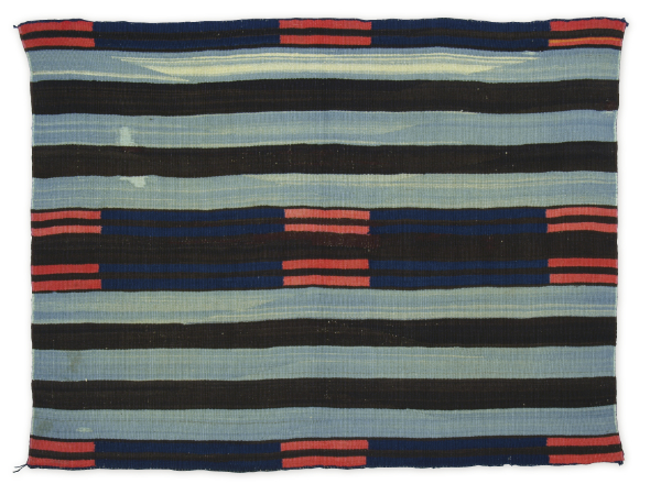 Artist once known (Diné), chief blanket II, ca. 1850–1865. Handspun
wool, indigo dye, bayeta, commercial wool yarn. 38 × 50 inches. Gift of Mrs.
Philip B. Stewart. MIAC Collection: 9129/12.