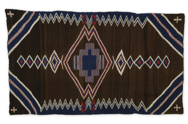 Artist once known (Diné), poncho/serape, 1870–1880.
Handspun wool, bayeta, indigo dye. 84½ × 51 inches. Harry Kelly Collection.
MIAC Collection: 9159/12.1.