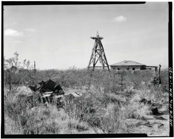 McDonald Ranch: View from East showing debris of windmill in foreground – White Sands Missile Range, Trinity Site, Vicinity of Routes 13 & 20, White Sands, Doña Ana County, NM. Courtesy Library of Congress Prints and Photographs Division, item no. HAER NM,27-ALMOG.V,1A—30.