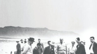 Ground Zero Trinity site, epicenter of first explosion, San Antonio, New Mexico, 1945. J. Robert Oppenheimer (center left) and Lieutenant General Groves (center) investigate the wreckage. Courtesy the Santa Fe New Mexican Collection, Palace of the Governors Photo Archives (NMHM/DCA), neg. no. HP.2014.14.1712.