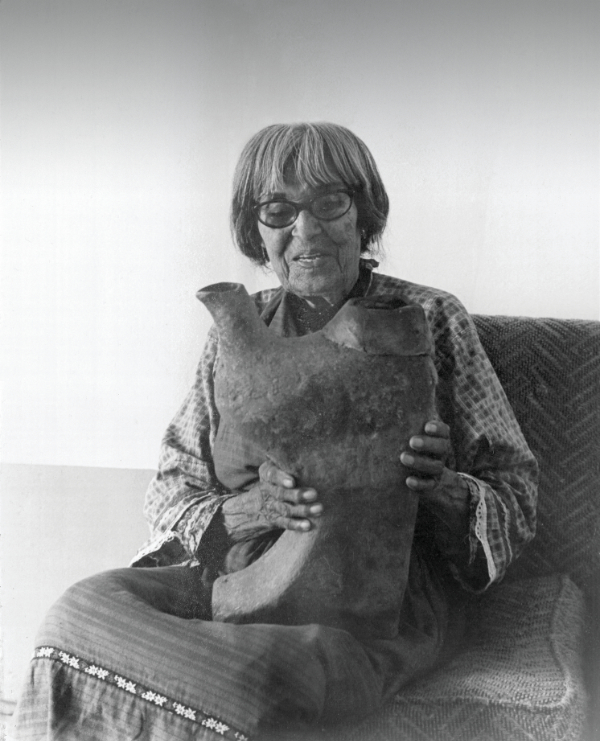 Maria Martinez holding a Rick Dillingham Gas Can, before 1980. Collection of the New Mexico Museum of Art. Gift of Diane and Sandy Besser, 1998 (1998.39.2). Photograph by Rick Dillingham.