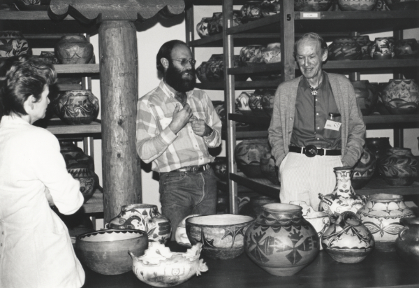 Rick Dillingham (center), a speaker at the 1991 Collector’s Symposium, in the vaults of the Indian Arts Research Center, with James J. Butler, attendee (right), August 12, 1991. Courtesy of the School for Advanced Research, Rick Dillingham Archive, file AC:3-40:1.