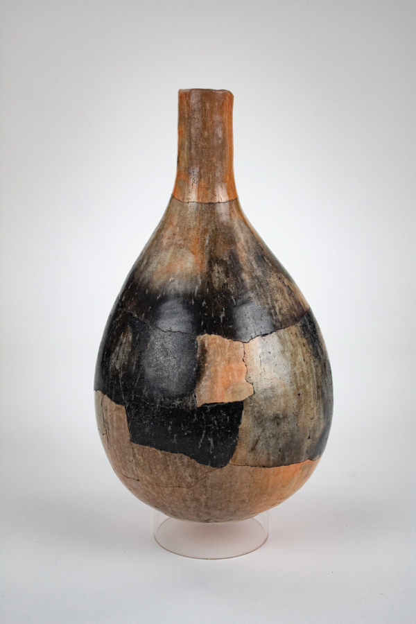 Rick Dillingham, Tubular Neck Vessel, 1976. Pit-fired, reassembled, burnished earthenware, 14 ¾ x 8 inches. Private Collection. Photograph by Orlando Dugi.
